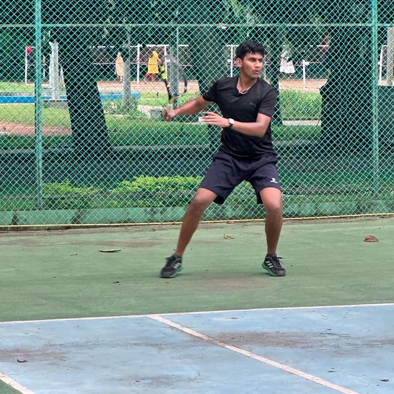 Holding a trophy on court